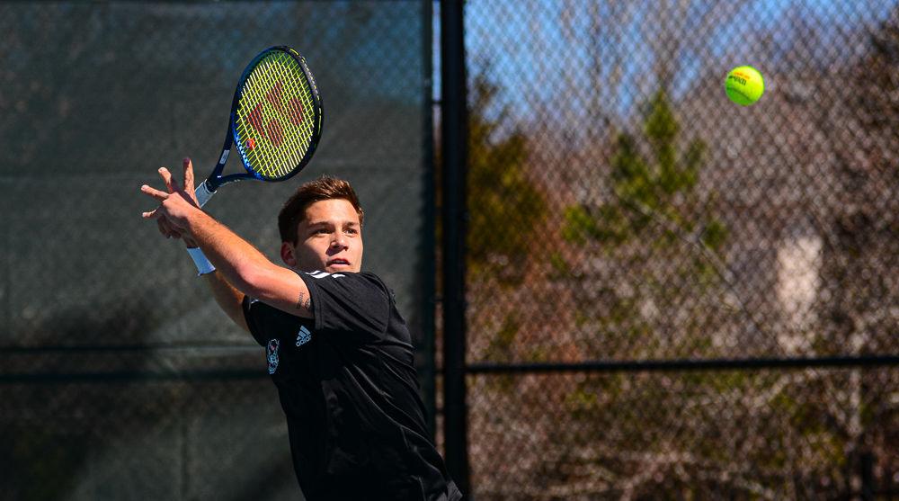 Senior Alexis Galarneau returns the ball during a doubles match against Texas on Sunday, March 1 at Cary Tennis Park. Galarneau and freshman Robin Catry won the match 6-4 and Galarneau later won his singles match 6-7(4), 7-6(5), 6-1 to give the Wolfpack a 4-3 team win.