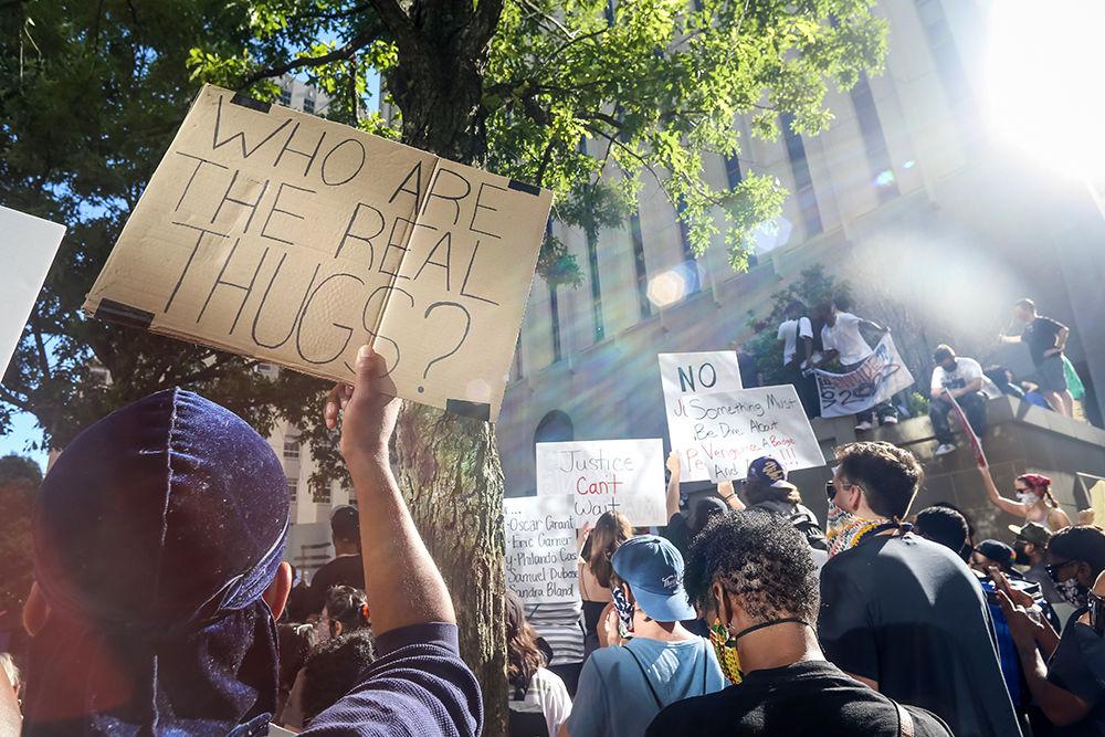Protesters pack the area in front of the Wake County Courthouse during the protests in downtown Raleigh against police violence on Saturday, May 30, 2020. The nationwide protests against the killing of George Floyd by police in Minnesota have led to a week of riots and violence.