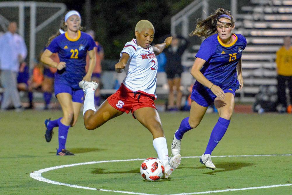Junior midfielder Tziarra King shoots the ball against ECU on Thursday, Aug. 23, 2018 at Dail Soccer Field. Despite playing two overtime halves, the Wolfpack tied the Pirates 1-1.