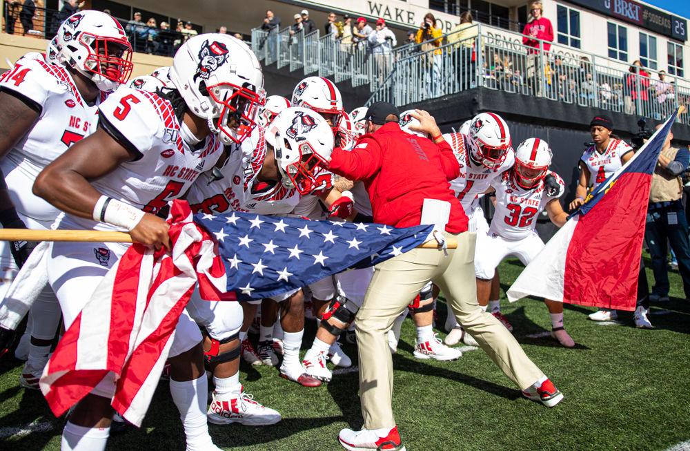 Dave Doeren prepares to run out with the Wolfpack football team on Saturday, Nov. 2, 2019 at BB&amp;T field. The Wolfpack lost 44-10.