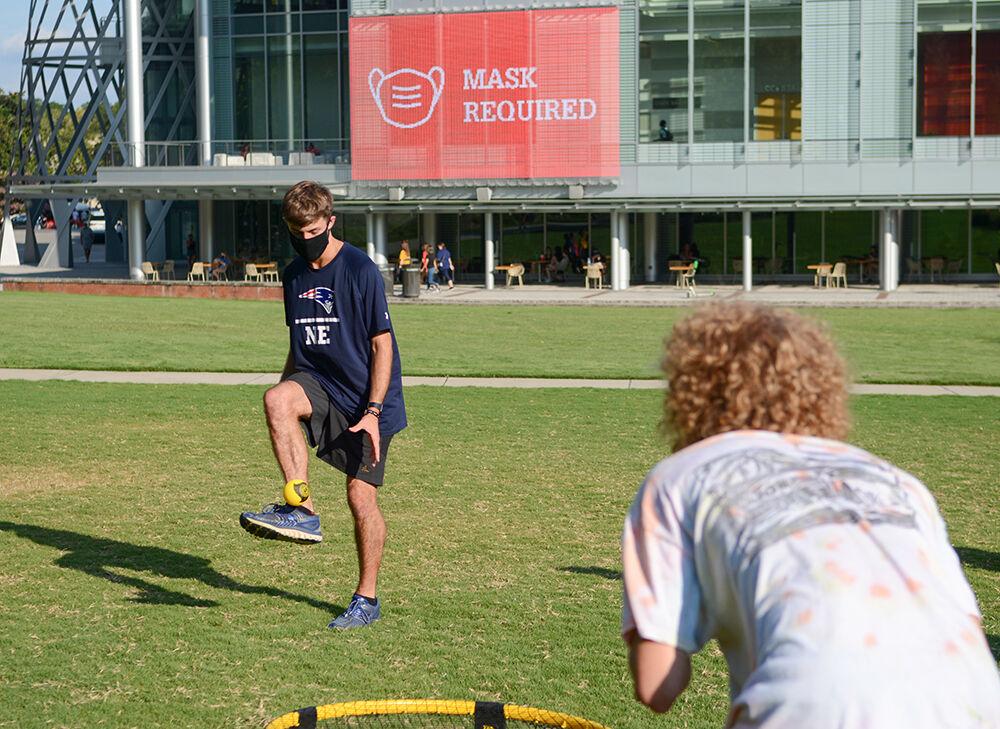 William Simas, a 2nd year studying sustainable materials and technology, keeps the ball alive while playing spikeball against Shane Tillett, a 2nd year studying math, at the Tally Center on Tuesday, August 11th, 2020.&#160;