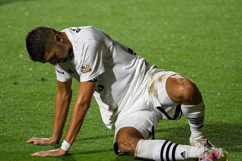 North Carolina FC midfielder Manny Perez pushes himself up after a missed pass during the game versus Birmingham Legion FC on Saturday, Aug. 15, 2020 in Sahlen's Stadium at WakeMed Soccer Park. North Carolina FC defender Conor Donovan grabs his head after hitting heads with a Birmingham Legion FC player during the second half of the game on Saturday, Aug. 15, 2020 in Sahlen's Stadium at Wake Med Soccer Park. NCFC lost to Birmingham Legion FC 2-0.
