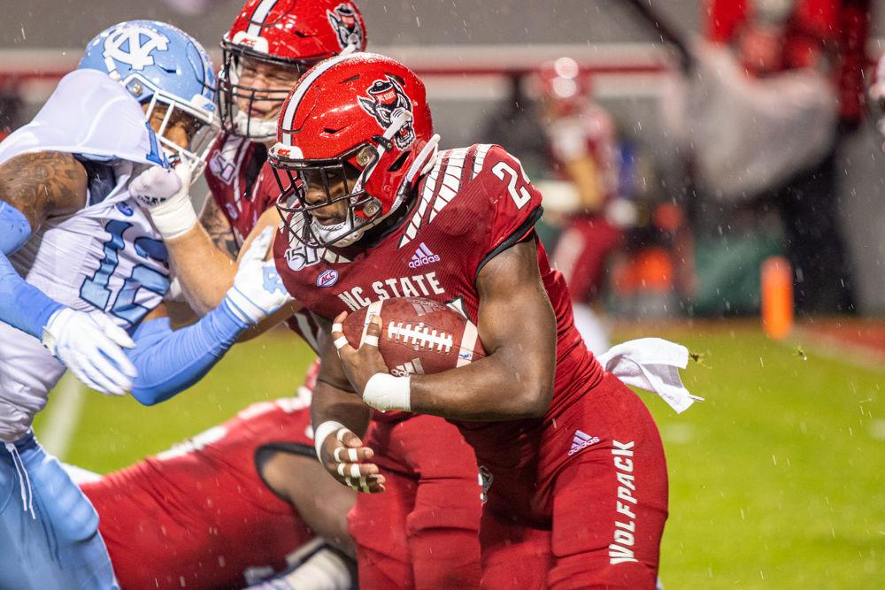 Freshman running back Zonovan Knight rushes versus UNC on Saturday, Nov. 30, 2019 at Carter-Finley Stadium. Knight had 56 rushing yards in the 41-10 loss.