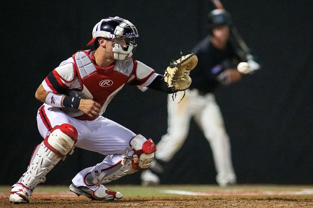 Junior catcher Andrew Knizner warms up before an inning. NC State lost its second regional game to Coastal Carolina 4-0 on June 4, 2016, at Doak Field after rain delayed the game from the previous day.