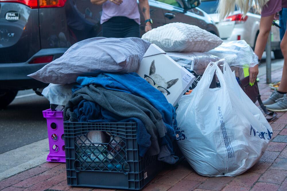 Personal belongings are unloaded outside of Tucker Residence Hall during move in on Saturday, Aug. 1, 2020. Students were given specific move in time slots to reduce the amount of people in the dorms.