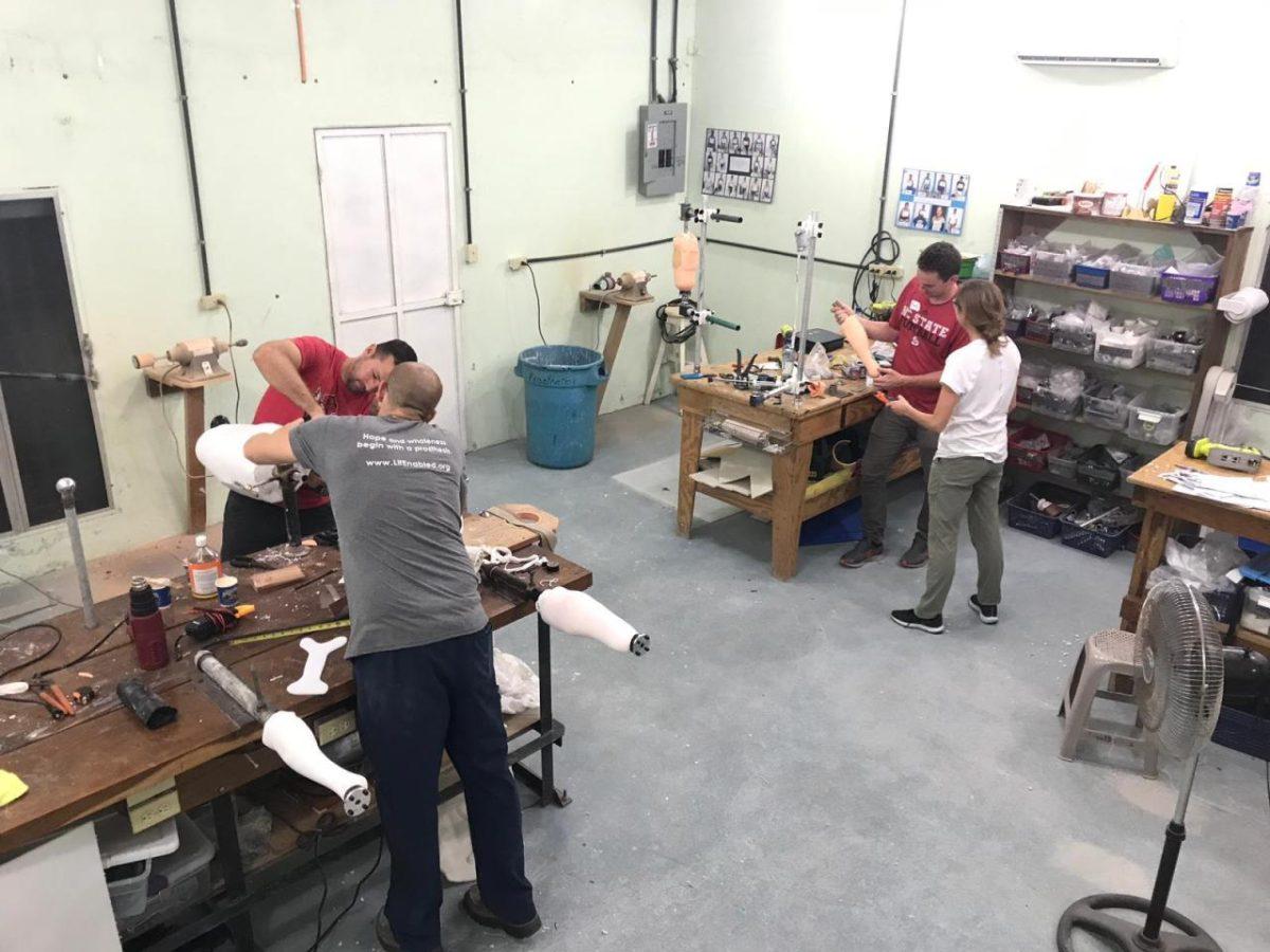 Members of OpenGait work on prosthetics.