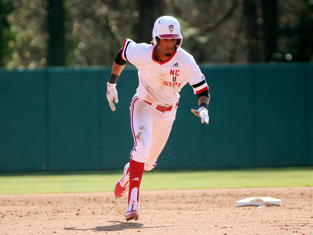 First year infielder Jose Torres rounds second base at the baseball game against James Madison at Doak Field on Saturday, Feb. 15. The Wolfpack played James Madison 3 times over the weekend.