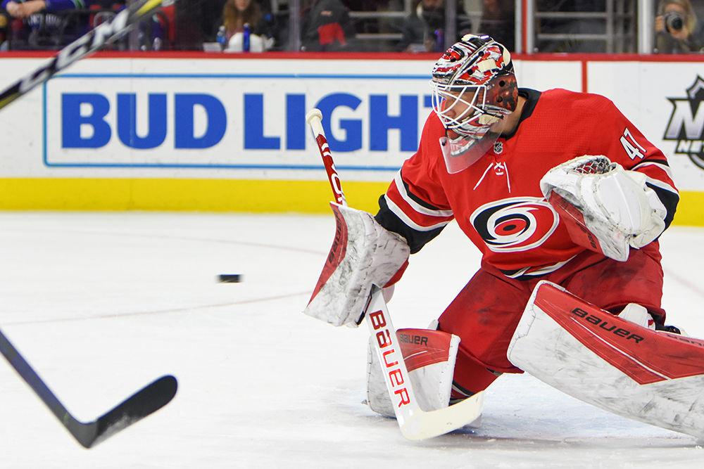 Carolina Hurricanes goalie James Reimer stops the puck during the game versus the Vancouver Canucks on Sunday, Feb. 2, 2020 in PNC Arena. The Hurricanes beat the Canucks in the shootout to win the game 4-3.