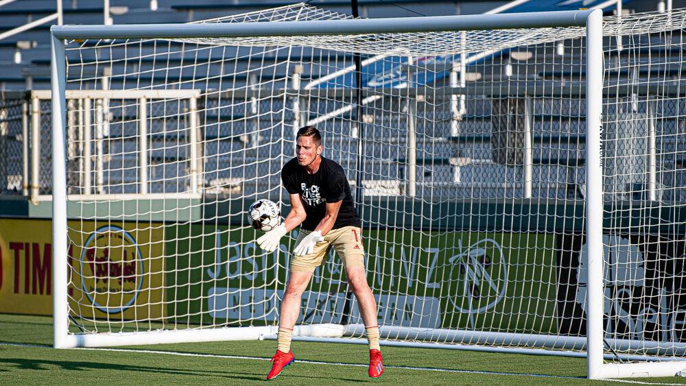 North Carolina FC goalkeeper Alex Tambakis warms up while wearing a Black Lives Matter t-shirt before playing Charleston Battery on Wednesday, Aug. 19, 2020 at WakeMed Soccer Park. Tambakis recorded five saves and conceded three goals as NCFC lost 3-0.