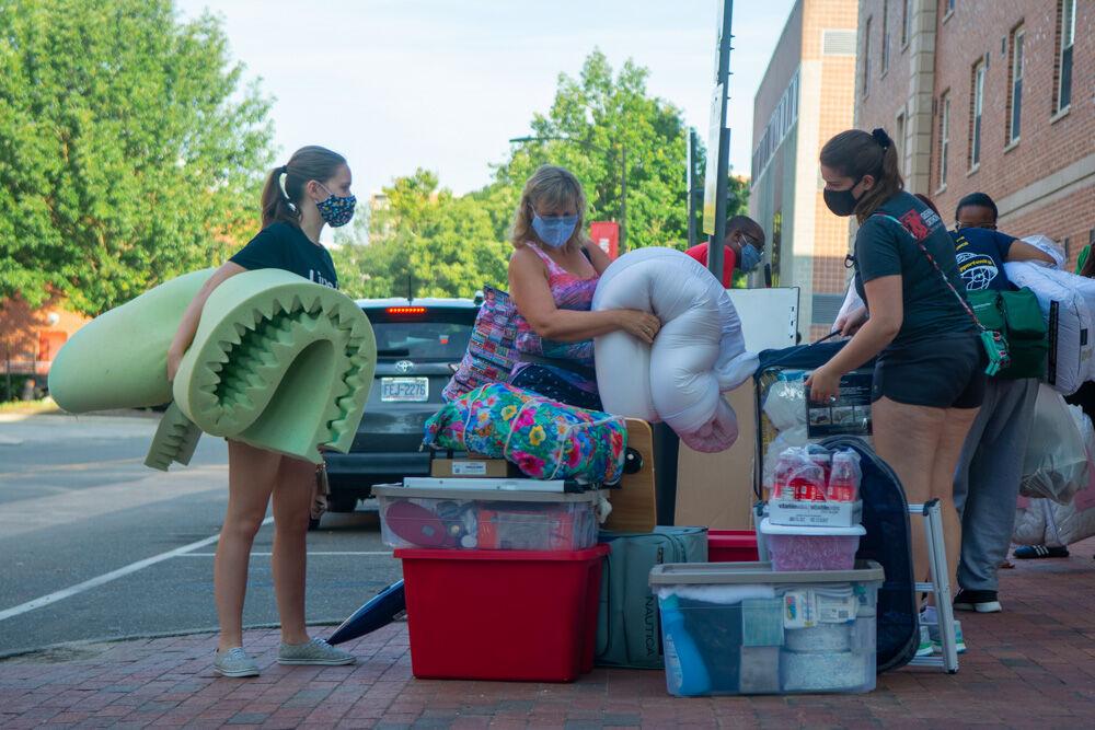 Rachel Taylor, a first year in exploratory studies, moves in her belongings into Tucker Residence Hall along with her family on Saturday, Aug. 1, 2020. The modified move in schedule for this year prevents unnecessary traffic in the dorms.