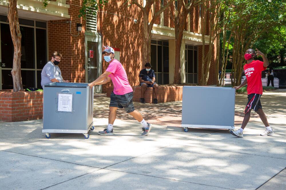 Resident Advisors for the Tri-Towers transport bins to help student move in on Saturday, Aug. 1, 2020. The bins were sanitized in between use to prevent the spread of COVID-19.