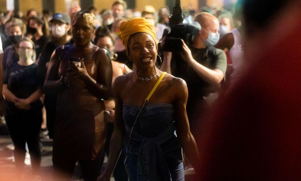 A protester gives an impassioned speech to the crowd in downtown Raleigh on Friday, Aug. 28, 2020. This Raleigh resident spoke on her community off of Exit 300, how her grandmother owns a home there, and how her grandmother's parents owned that home before her. She spoke on the gentrification and over policing of her neighborhood, mentioning the fact that multiple police stations can be found within a 1-2 miles of each other, all near her community.
