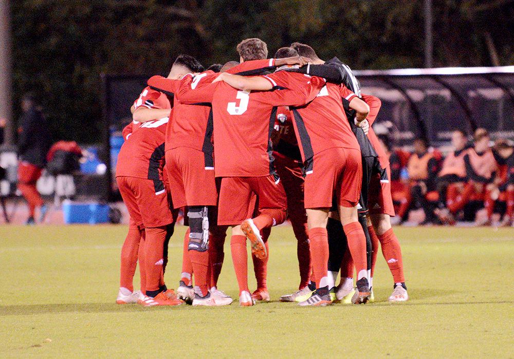The NC State men's soccer team huddles before the beginning of the game. The Wolfpack lost 0-3 against Clemson on Friday, Nov. 1, 2019 at Dail Soccer Field.