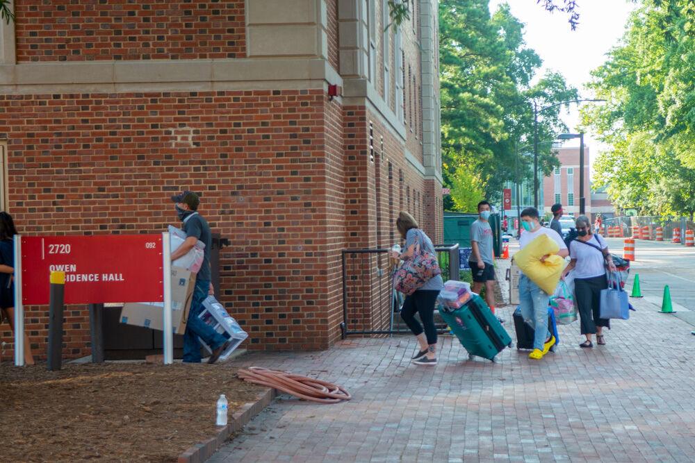 Students and their families move belongings into Owen Residence Hall during move in for the fall semester on Saturday, Aug. 1, 2020.&#160;