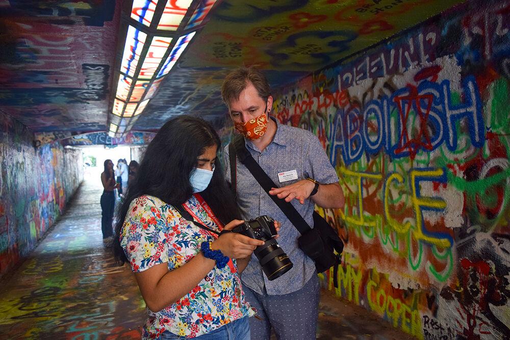 Ray Black, photo advisor for student media, helps Isabel Kishore, a first-year in exploratory studies sort through photos during the Welcome Week Photo Walk on Saturday, Aug. 8, 2020. Kishore did the photo walk because she was looking for a new experience where she could learn more about her photography hobby using professional equipment.&#160;