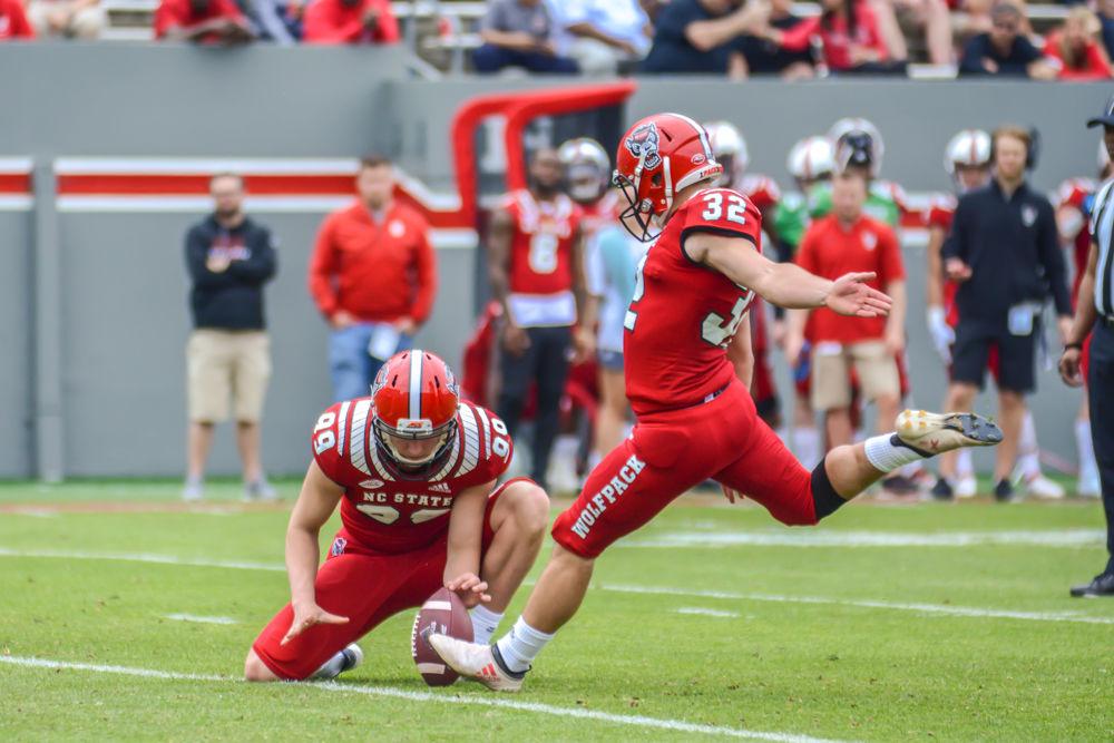 Sophomore kicker Christopher Dunn kicks a field goal while redshirt sophomore punter Trenton Gill holds the ball during the Kay Yow Spring Game on Saturday, April 6, 2019 in Carter-Finley Stadium.&#160;