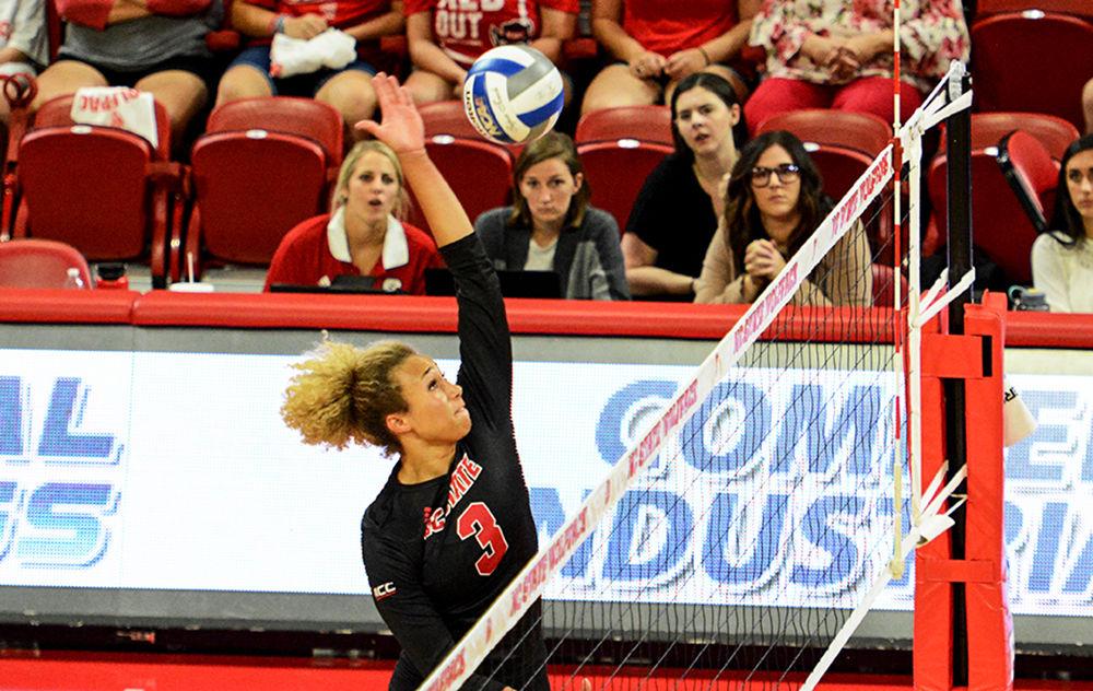 Junior opposite hitter Melissa Evans leaps for a spike. NC State defeated Kansas State in Reynolds Coliseum on Aug. 30th, 2019.