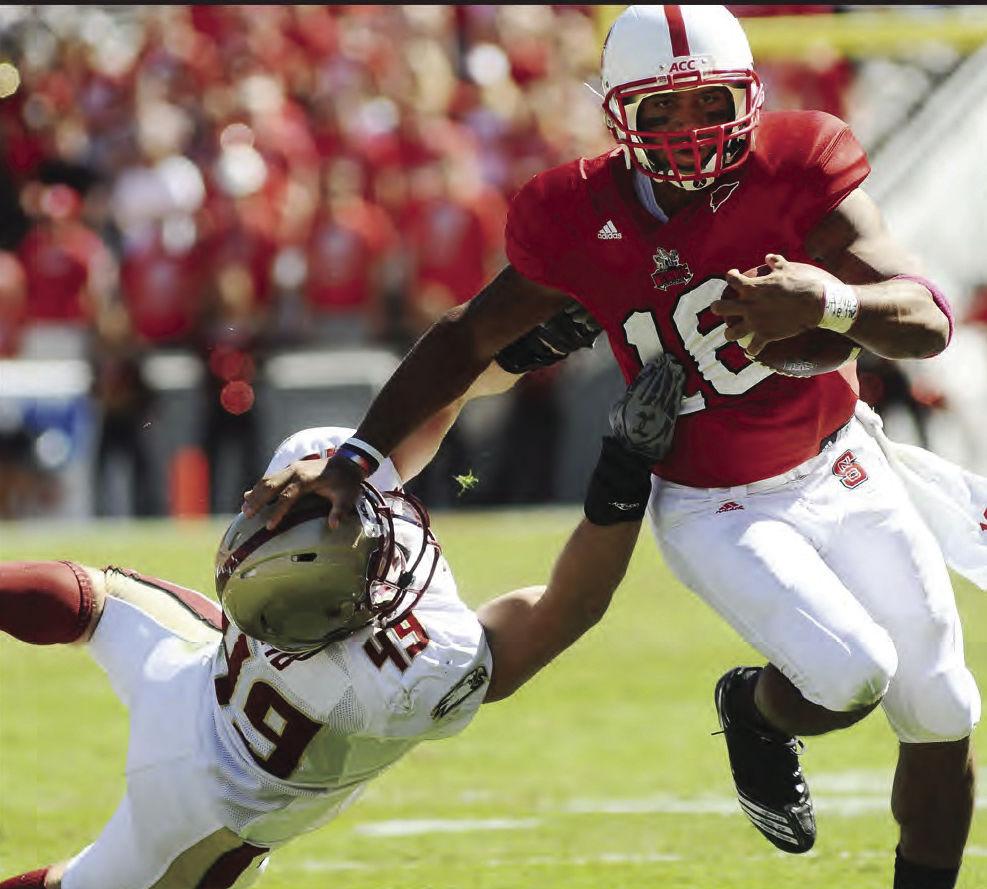 Redshirt junior quarterback Russell Wilson pushes a Boston College defenseman off as he breaks a tackle. Wilson was a key player this season for the Pack, using both his arm and his legs. Wilson accounted for 35 total touchdowns, helping the Pack to an 8-4 season.