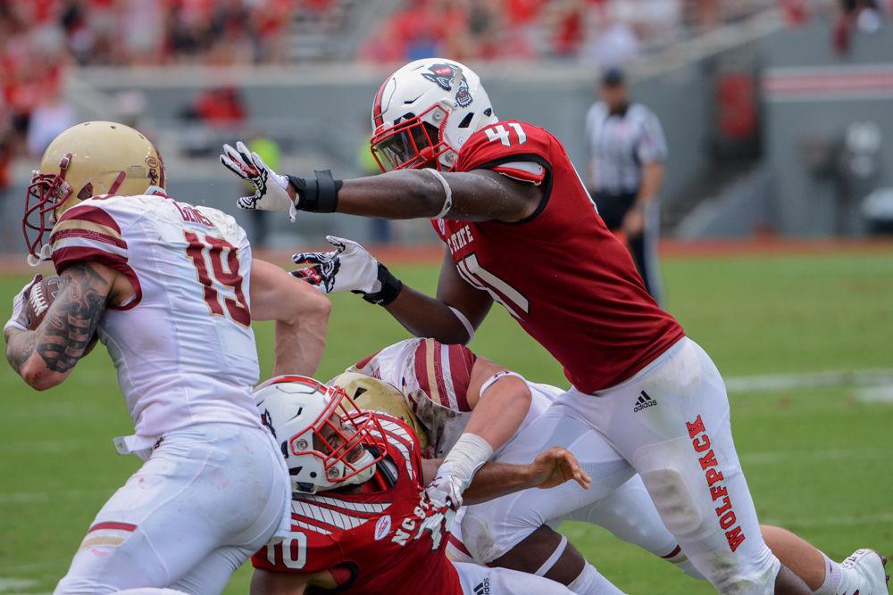 Redshirt freshman linebacker Isaiah Moore attempts to tackle Boston College wide receiver and running back Ben Glines on Saturday, Oct. 6 at Carter-Finley Stadium. Moore had 7 total tackles including 1 tackle for loss as the Wolfpack won 28-23.