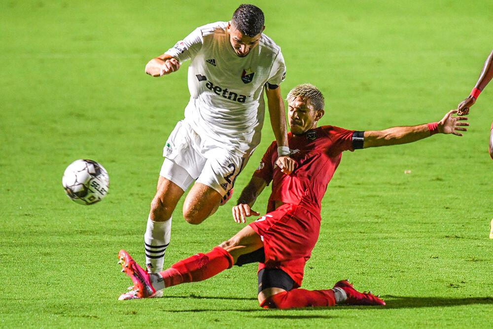 North Carolina FC midfielder Manny Perez gets the ball stripped from him by a Birmingham Legion FC slide tackle on Saturday, Aug. 15, 2020 in Sahlen's Stadium at WakeMed Soccer Park. NCFC lost to Birmingham Legion FC 2-0.