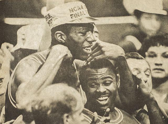 Thurl Bailey, Sidney Lowe and Dereck Whittenburg share a moment of ecstasy after State's 54-52 NCAA Championship victory over Houston.