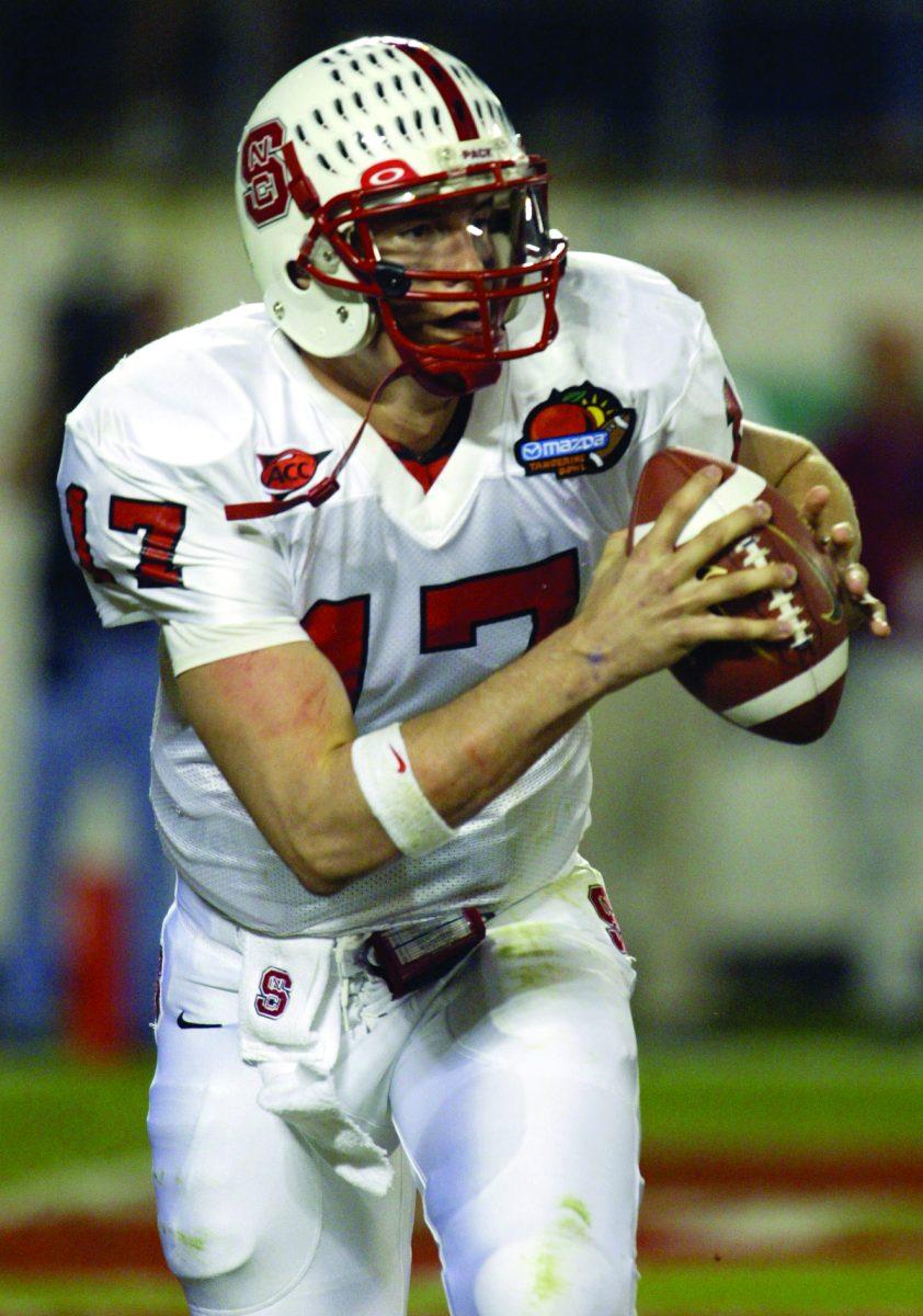 Philip Rivers scrambles and looks for a receiver to pass to during the Tangerine Bowl on Dec. 22, 2003.