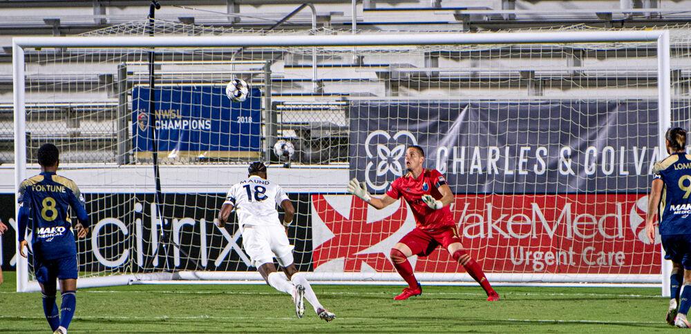 Charlotte Independence defender Aaron Mound sends a header past the reach of North Carolina FC goalkeeper Alex Tambakis&#160;on Saturday, Sept. 19 at WakeMed Soccer Park. The goal was the only goal of the game as Charlotte won 1-0.