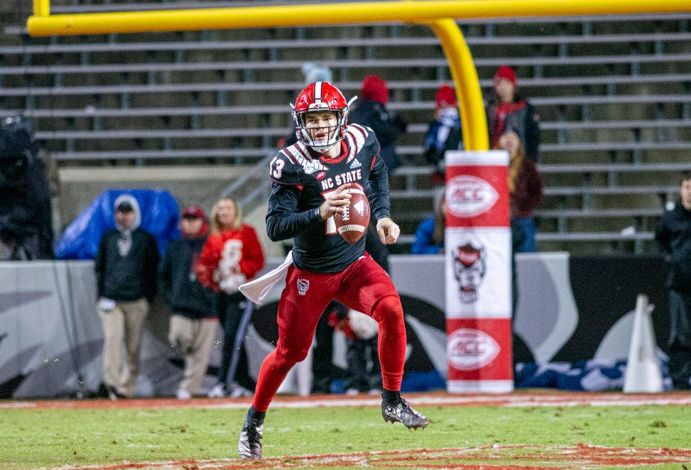 Redshirt freshman quarterback Devin Leary rushes versus Louisville on Saturday, Nov. 16, 2019 at Carter-Finley stadium. Leary threw for 243 yards and two touchdowns in the 34-20 loss.