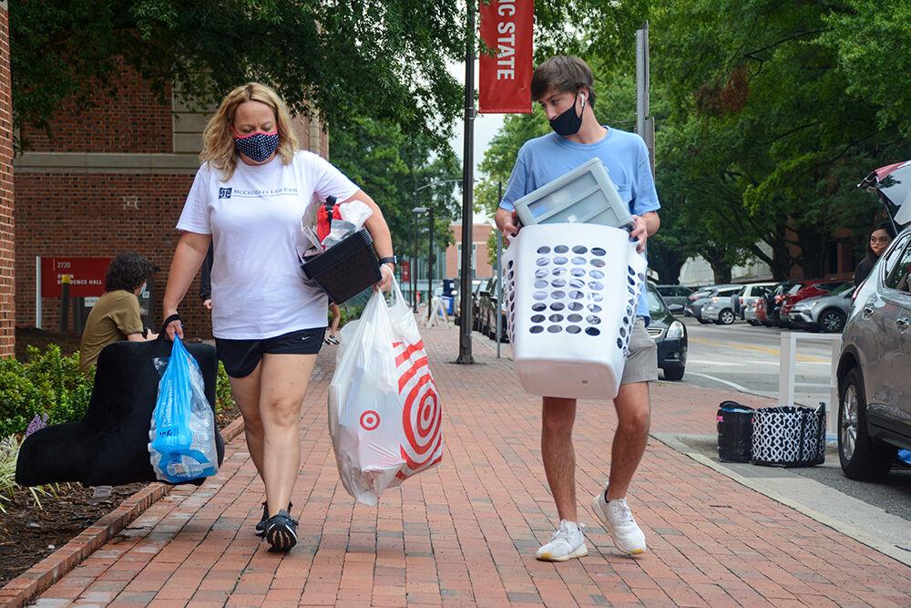 Jack McCroskey, a freshman in exploratory studies, moves his belongings out of Tucker Residence Hall along with the help of his mom during move out on Tuesday, Sept. 1, 2020. McCroskey is from Archdale, NC but he will be getting an apartment near campus after he heard the announcement that students were no longer allowed to live on campus.