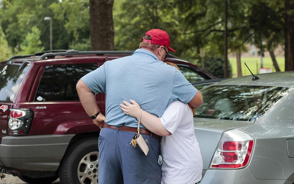Emily McNeill, a first-year studying communications, hugs her dad before they go back home on Sunday, Aug. 30, 2020. They received the news on Aug. 26 that NC State needed all students living in on campus housing to move out by Sep. 6. Even though Emily said that she expected that they would be kicked off campus, she was disappointed nonetheless.