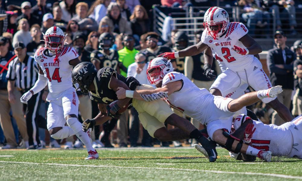 Redshirt freshman Payton Wilson tackles Wake Forest wide receiver Kendall Hinton on Saturday, Nov. 2, 2019 at BB&amp;T field. Wilson had 11 tackles total. The Wolfpack lost 44-10.