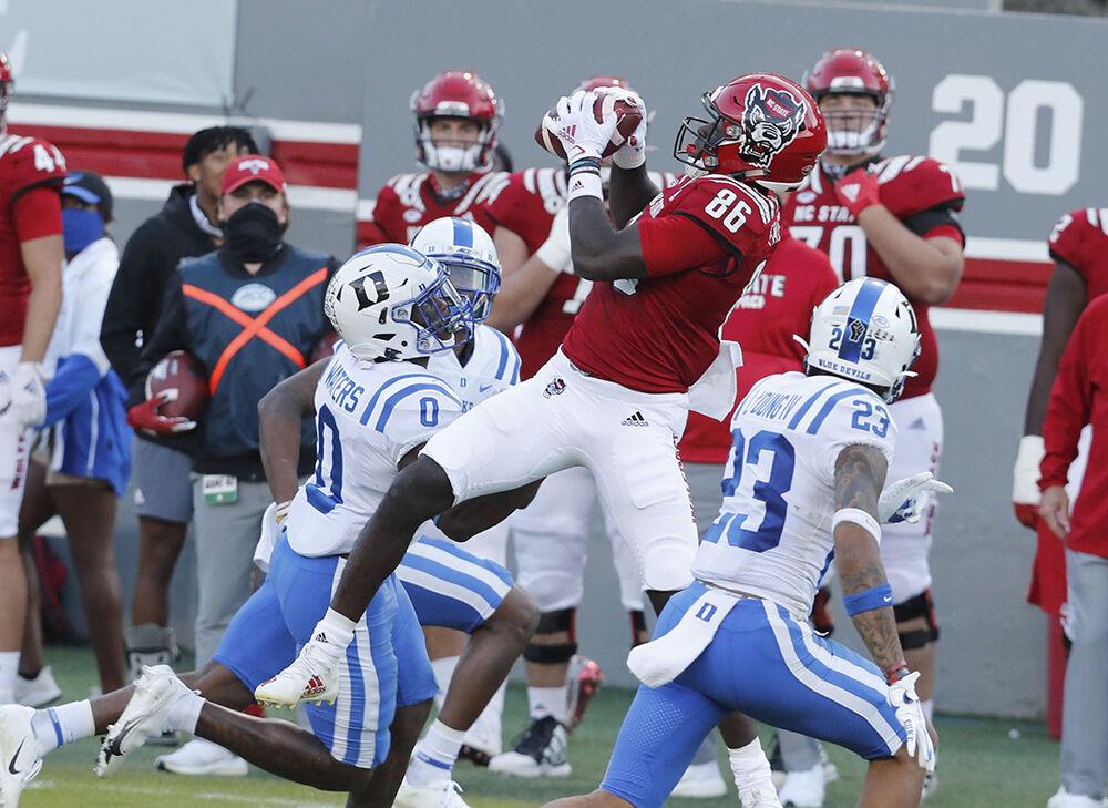 N.C. State wide receiver Emeka Emezie (86) pulls in the reception as Duke safety Marquis Waters (0) defends during the first half of N.C. State&#8217;s game against Duke at Carter-Finley Stadium in Raleigh, N.C., Saturday, Oct. 17, 2020.