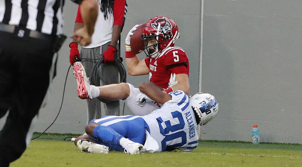 N.C. State wide receiver Thayer Thomas (5) makes a touchdown reception while defended by Duke safety Jalen Alexander (30) defends during the second half of N.C. State&#8217;s 31-20 victory over Duke at Carter-Finley Stadium in Raleigh, N.C., Saturday, Oct. 17, 2020.