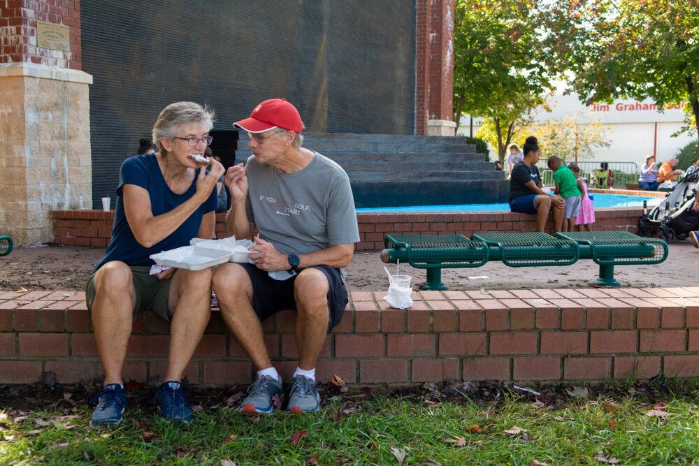 Jill and Randy Pafford enjoy fried Oreos together at the NC State Fair Food days event on Wednesday, Oct. 21. 2020. The Pafford&#8217;s usually come to the state fair multiple times a year, and in response to the fair being cancelled this year said, &#8220;At least we have this!&#8221;