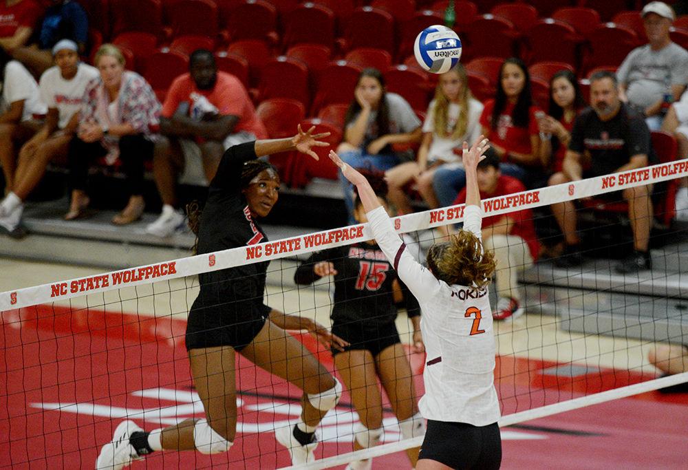 Sophomore middle blocker Pam Chukwujekwu spikes the ball against Virginia Tech on October 4 in Reynolds Coliseum. Chukwujekwu played in five sets and had nine kills, seven blocks and one dig in the 3-2 win over Virginia Tech.