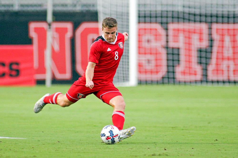 Sophomore midfielder Brad Sweeney prepares to kick the ball upfield against Florida Atlantic on Friday, Aug. 25, 2017 at Dail Soccer Field. The Wolfpack won 3-2.