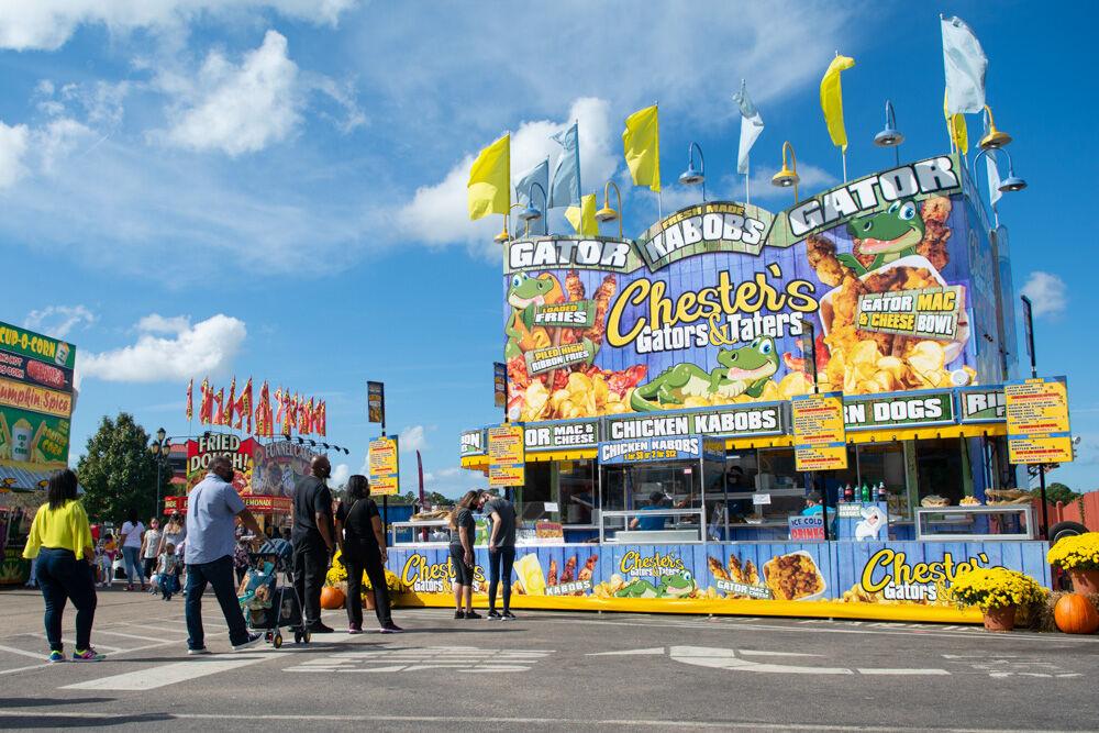 People wait in line for the Chester&#8217;s Gators &amp; Taters vendor at the NC State Fair Food days event on Wednesday, Oct. 21. 2020. The event features over 20 fair food vendors and is set to take place from Oct. 15-25.