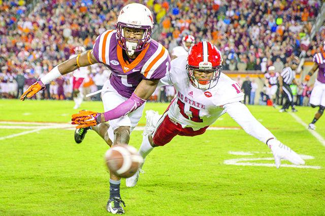 Graduate cornerback Juston Burris dives and covers the receiver, disallowing the catch against the Hokie receiver. Burris finished the game with three tackles and one tackle for a loss. The Wolfpack lost to the Hokies 28-13 at Virginia Tech in Lane Stadium on Oct. 9.