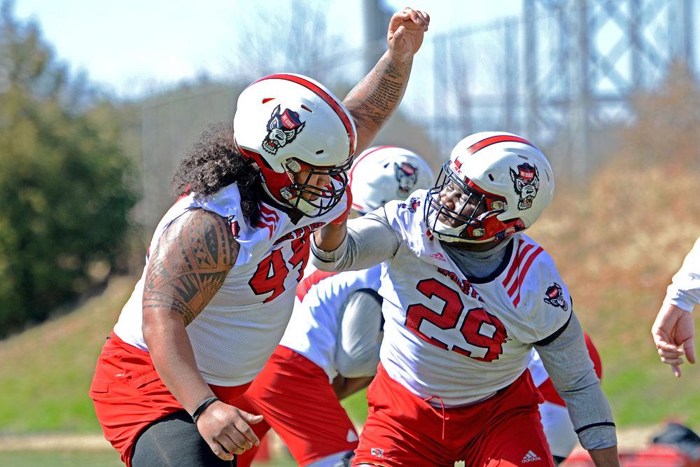 Sophomore defensive tackle Alim McNeill fights to get past freshman defensive tackle Joshua Harris on Saturday, March 2, 2019 at NC State Football&#8217;s outdoor practice fields.