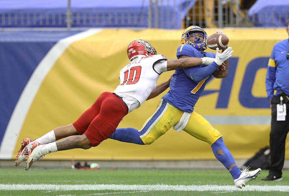 Oct 3, 2020; Pittsburgh, Pennsylvania, USA; North Carolina State Wolfpack safety Tanner Ingle (10) breaks up a pass intended for Pittsburgh Panthers wide receiver DJ Turner (7) during the third quarter at Heinz Field. The Wolfpack won 30-29. Mandatory Credit: Charles LeClaire-USA TODAY Sports