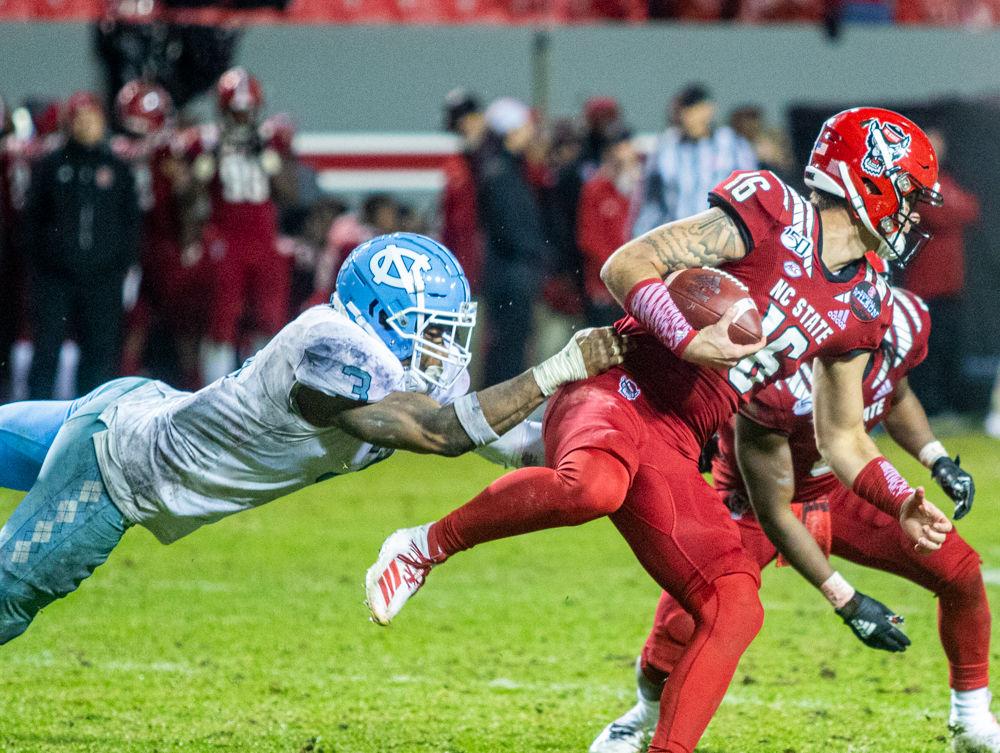 Redshirt sophmore quarterback Bailey Hockman is tackled during a rush versus UNC on Saturday, Nov. 30, 2019 at Carter-Finley stadium. Hockman threw for 59 yards in six completions in the 41-10 loss.