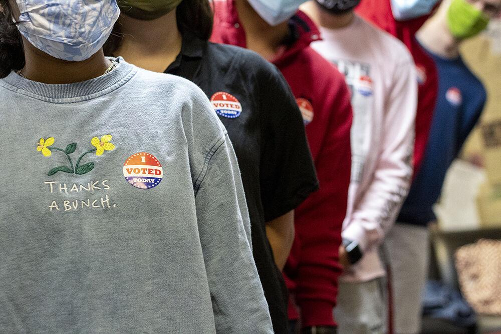 Students line up all wearing "I Voted Today" stickers in Witherspoon on Wednesday, Oct. 14, 2020.
