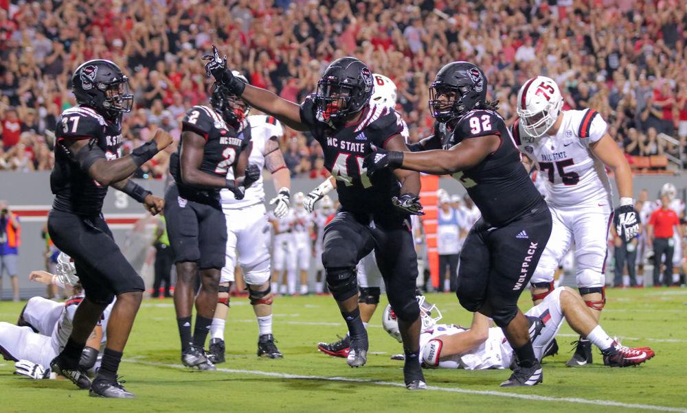 Redshirt sophmore linebacker Isaiah Moore celebrates after a sack versus Ball State on Saturday, Sep. 21, 2019 at Carter-Finley Stadium. Moore had six tackles total at the game the Wolfpack won 34-23.
