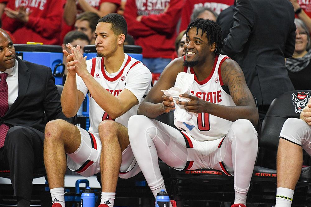 Redshirt junior DJ Funderburk and sophomore forward Jericole Hellems smile on the bench during the game versus Pittsburgh on Saturday, Feb. 29, 2020. Hellems scored 16 points and Funderburk scored 14 points against the Panthers. NC State beat Pittsburgh 77-73.