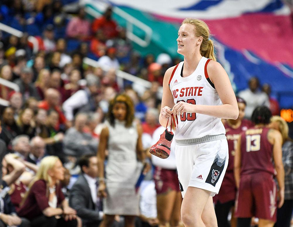 Sophomore center Elissa Cunane holds her shoe after it fell off in the fourth quarter during the 2020 ACC Women's Tournament championship game versus the Florida State Seminoles on Sunday, March 8, 2020 in the Greensboro Coliseum. This is the Wolfpack's first ACC tournament championship since 1991. The Wolfpack beat the Seminoles 71-66.