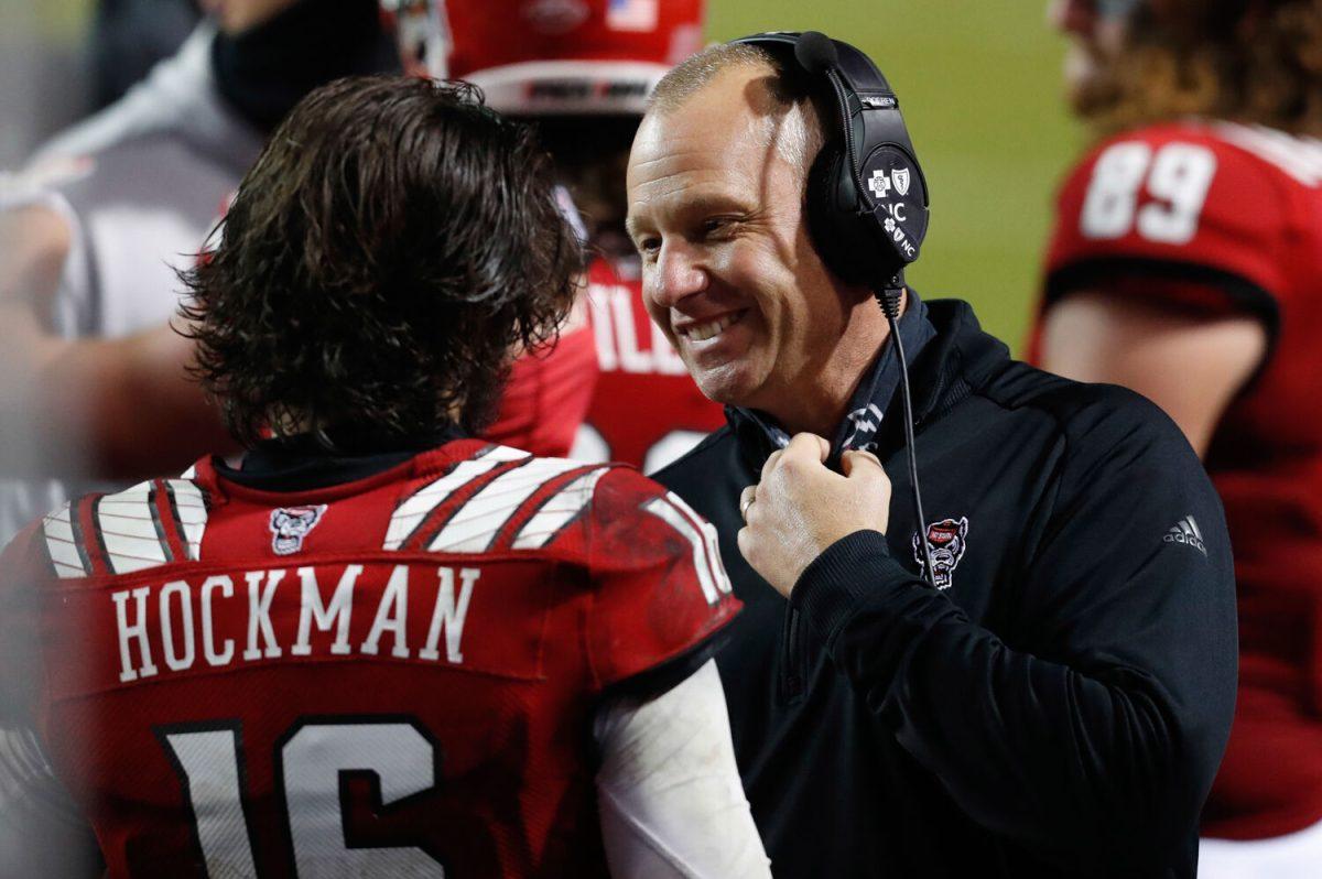 N.C. State head coach Dave Doeren talks with quarterback Bailey Hockman (16) during the second half of N.C. State&#8217;s 15-14 victory over Liberty at Carter-Finley Stadium in Raleigh, N.C., Saturday, Nov. 21, 2020.