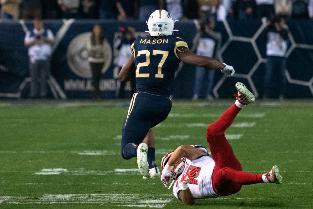NC State sophomore safety Tanner Ingle misses a tackle during NC State's game against Georgia Tech at Bobby Dodd Stadium on Nov. 22, 2019. The Wolfpack lost, 28-26.