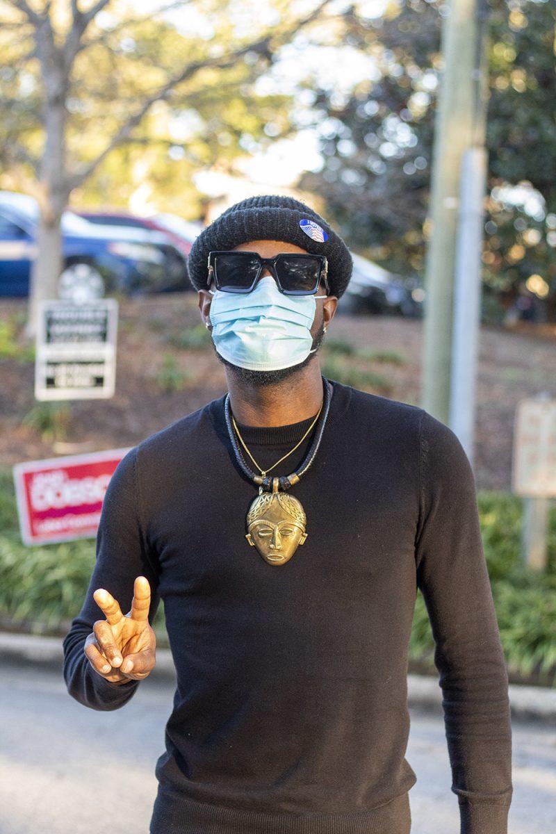 Evrick Lee, a musician, poses after voting in the 2020 election outside of Pullen Community Center on Tuesday, Nov. 3, 2020.