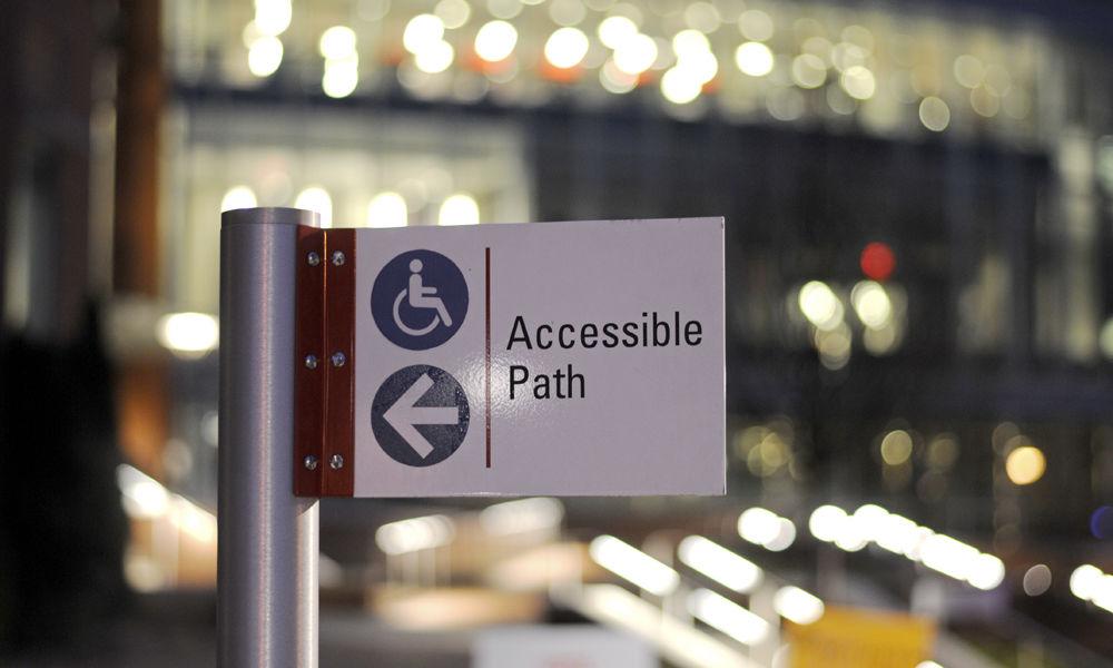 An accessibility sign stands in front of Talley Student Union on Wednesday, Feb. 28, 2018. These signs are important for directing those who are not able to take some paths toward an alternative in order to access major campus buildings.