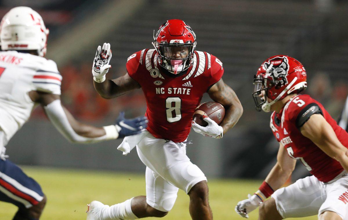 N.C. State&#8217;s Ricky Person Jr. (8) looks for running room during the first half of N.C. State&#8217;s game against Liberty at Carter-Finley Stadium in Raleigh, N.C., Saturday, Nov. 21, 2020.